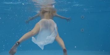 Finnish girl swims nude in the pool