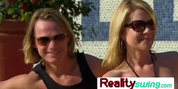 Hot summer vibes for a swinger brunette receiving softcore oral sex by horny strangers