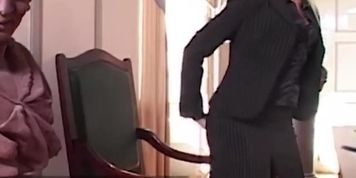 Headmistress Sandy pleasures herself with a dildo