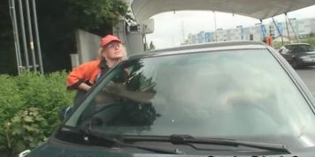 Old woman swallows two cocks outdoors