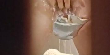 Teen caught touching herself in the shower