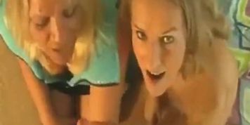 Two blonde housewives share a lad