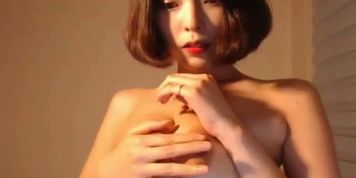 Sensual Korean babe shows her big boobs