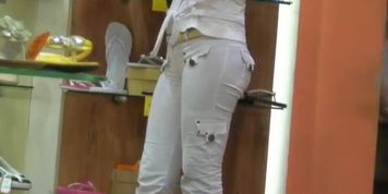Sweet candid street booty in a shoe store