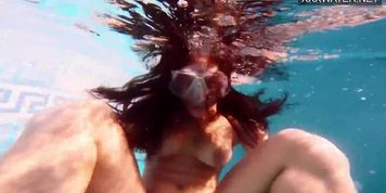 Amelie Bruna tasty brunette with big boobs in the pool