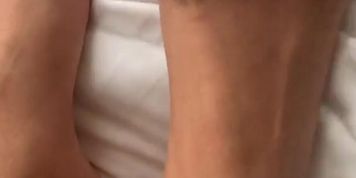 Wish you were here!  Hot woman with sexy feet grips the sheet with her toes