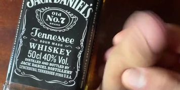 Sweet boy at hotel room mastrubate his cock with big whiskey bottle 