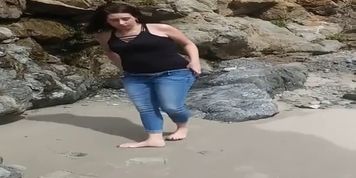 My wife pissing on the beach