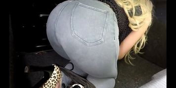 TIED blonde in trunk of CAR PISSES in pants! Wet jeans pee girl!