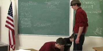 The classroom is empty except for Maddox and Spencer