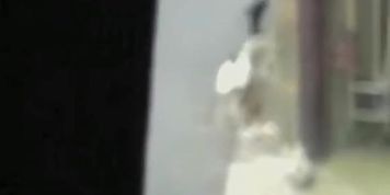 Open-minded hot babe is walking on the street during fast sharking attack