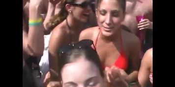 Horny crowd watches cutie flash big titties at beach party