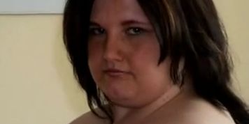 Fat young woman with big tits stripping and playing