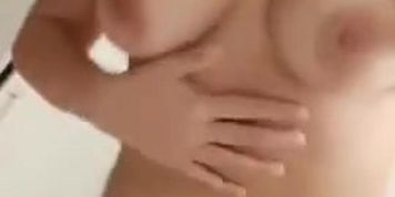 Brunette stripping and rubbing her vagina 