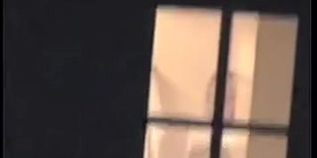 Window voyeur lover admires big titted nude female