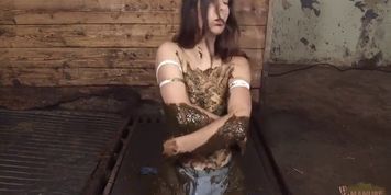 Teen girl gets messy on a farm and baths and covers herself in filthy mud