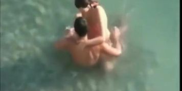 Some folks fucking on a beach
