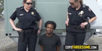 Huge black cock is getting sucked hard in public by two big booty MILFs