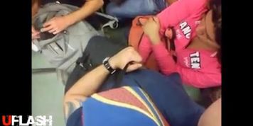 Woman graps mens cock on bus