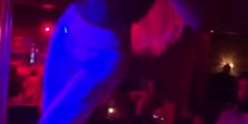 Nicolette Shea pole dancing in a go-go club
