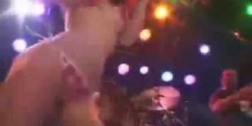 Chicks dancing on stage in bikinis and shakin their asses