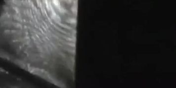 Voyeur peeping through the bathroom window