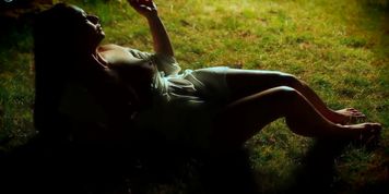 Sandra Romain smokes a cigarette and masturbates in the park
