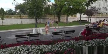 Busty slave bathing in fountain outdoor