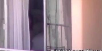 HI Voyeur Couple bj in the window