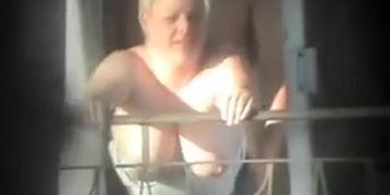 Busty cougar gets dicked on the balcony (Nothing special)