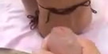 Horny Guy Jerks Off Behind Bikini Woman's Back