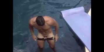 American bodybuilder Darren Fernandez showing off his small dick in a pool