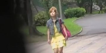 Fascinating perky vixen flashes her snatch when someone lifts her skirt