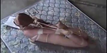 Hogtied on a Filthy Mattress