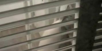 Trying to voyeur nudity details through the window blinds