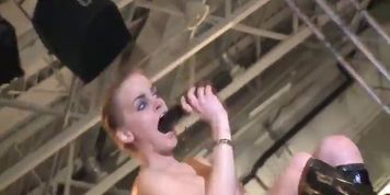 busty girl fisting on public stage