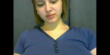 A pregnant girl gets naked and caresses her pussy