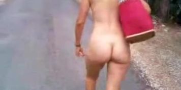 woman walking naked on the road