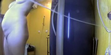 Chubby mature lady rubs lotion on body