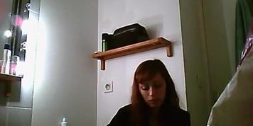 Teen changing clothes in bathroom