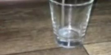 dipping my cock into a shot glass full of my own cum that I froze and thawed 1