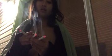 Asian smoking 3 cigarettes at once