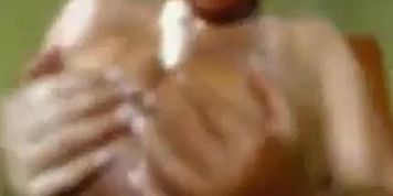 Busty brunette babe with huge boobs stripteasing and seducing on webcam