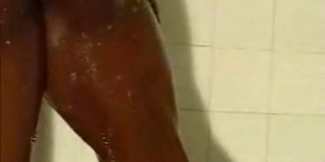 Black Female Bodybuilder taking a shower 2