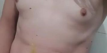 Little dick trans girl pissing on herself