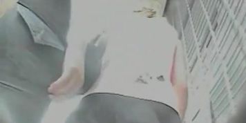 Lovely upskirt shot of wavy short skirt and tight jeans