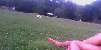 Girl in tiniest bikini getting sun tanned in the field PICT0011