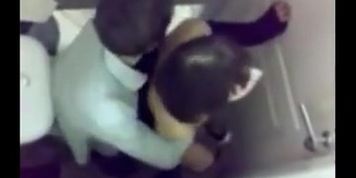 Spying on couple in the cubicle