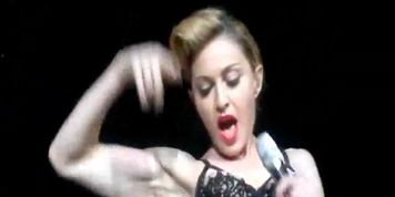 Celeb madonna flashing her bare breasts onstage during concert