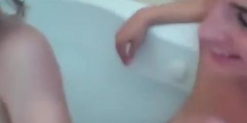 Naughty Brunette And Blonde Lesbians Having Fun In A Tub
